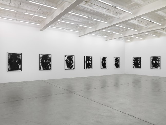 Installation view of Adam Pendleton and Pope.L wall-based works and sculptural installation