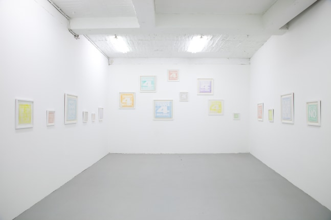 Installation view of wall works by John Giorno