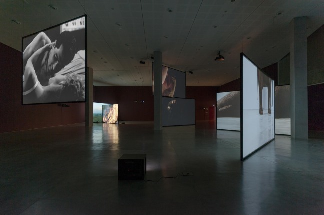 Installation view of photographs and sculptures by Douglas Gordon