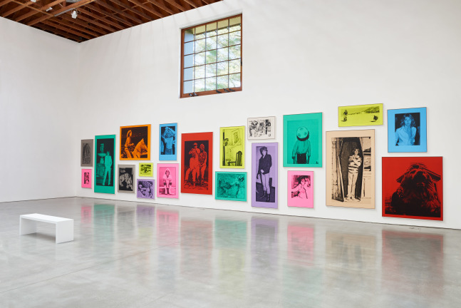 Wall installation of prints by Steven Shearer