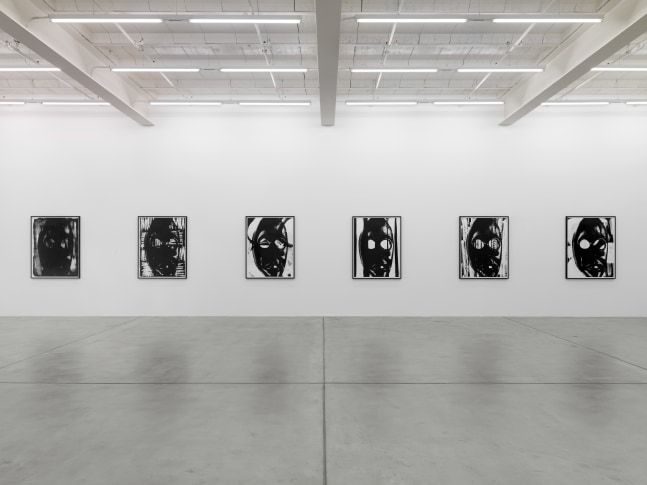 Installation view of Adam Pendleton and Pope.L wall-based works and sculptural installation