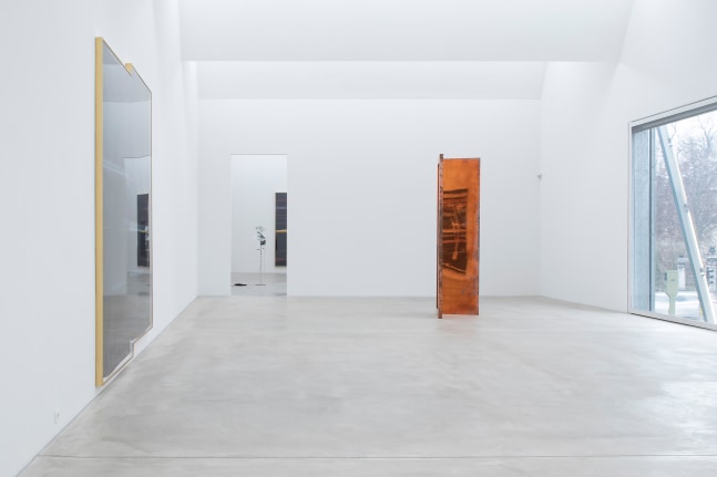 Installation view of sculptures and wall works by Walead Beshty