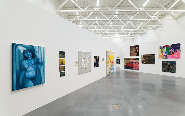 Installation view of painting by Tschabalala Self and paintings of other artists