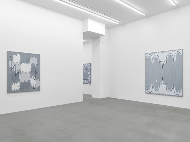 installation view of grayscale paintings by Amy Feldman