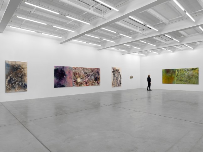 Installation view of Sam Falls paintings and ceramic reliefs exhibition