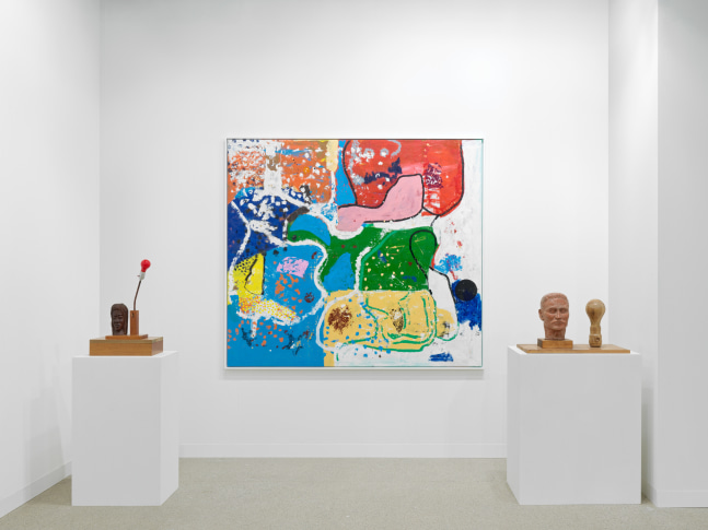 installation view of paintings and sculptures by various artists