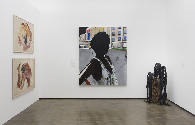 Installation view of paintings by Tschabalala Self and works of other artists