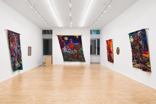 Installation view of drawings and textile works by Athi-Patra Ruga