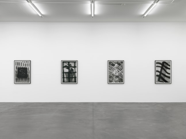Installation view of Wyatt Kahn wall reliefs and photographs