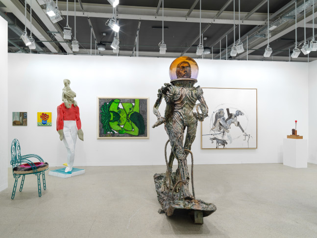 installation view of paintings and sculptures by various artists