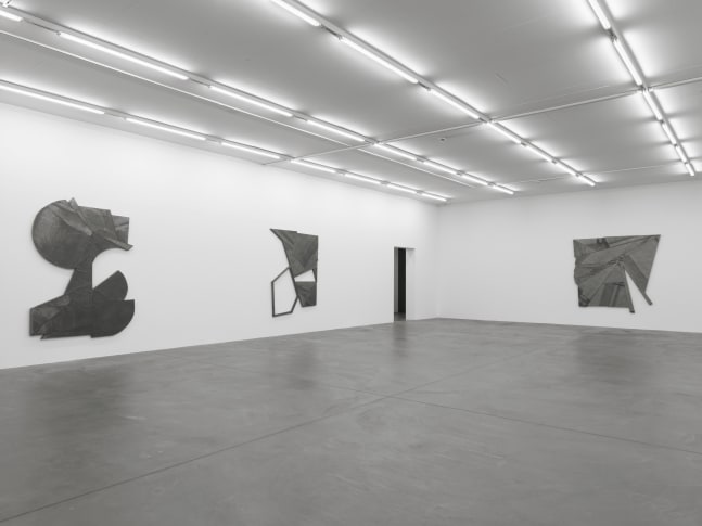 Installation view of Wyatt Kahn wall reliefs and photographs