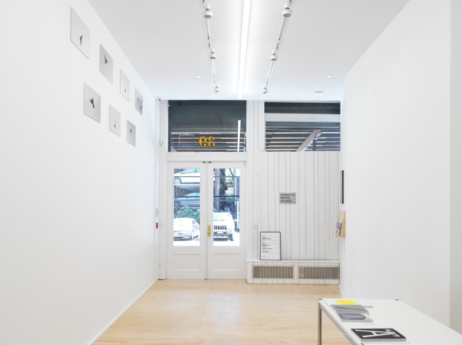 Installation view of photographs by Shannon Ebner