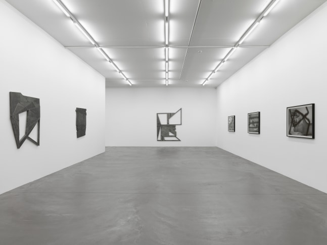 Installation view of Wyatt Kahn wall reliefs and photographs