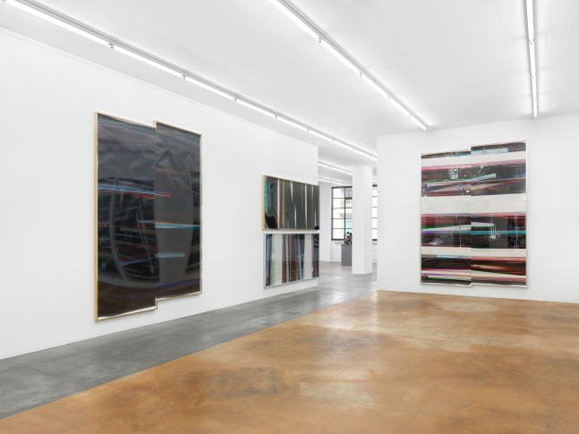 Installation view of wall works by Walead Beshty
