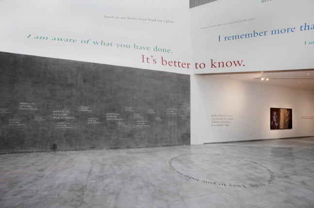 Installation view of wall quotes by Douglas Gordon