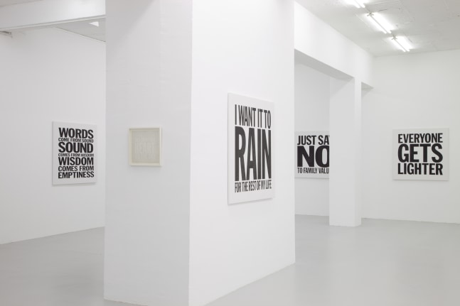 Installation view of wall works by John Giorno