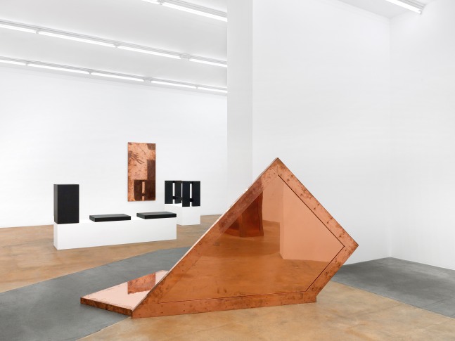 Installation view of sculptures and wall works by Walead Beshty