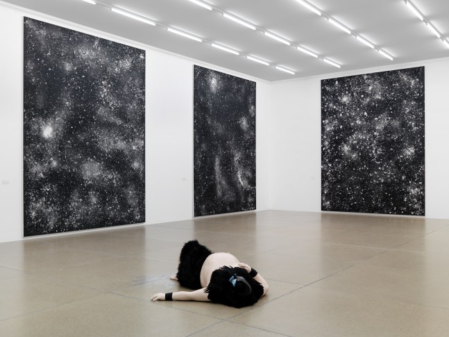 Installation view of sculptures and paintings by Ugo Rondinone