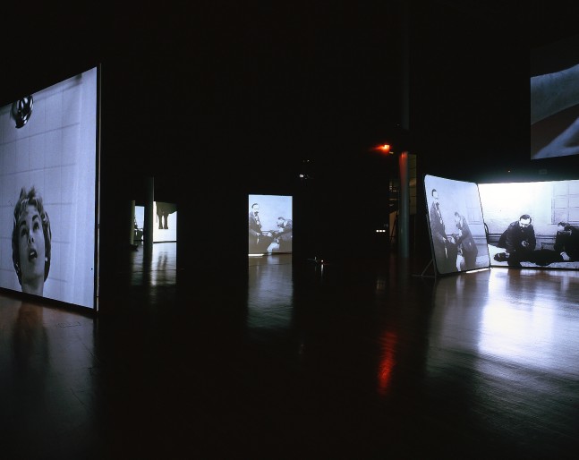 Installation view of video works by Douglas Gordon