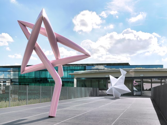 Installation view of two Mark Handforth sculptures on terrace
