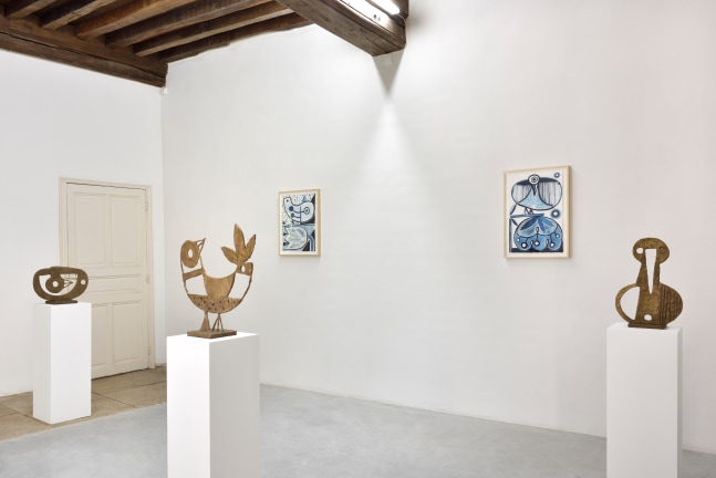 Installation view of paintings and sculptures by Austin Eddy