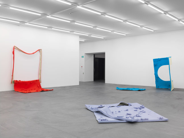 Installation view of Alex Hubbard sculptural paintings and film exhibition