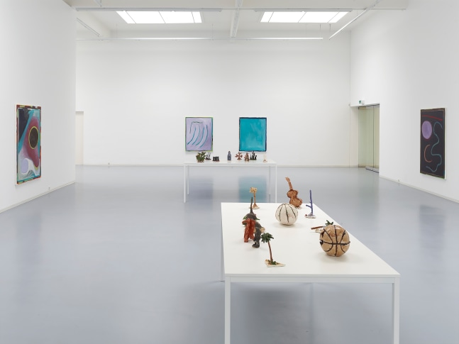 Installation view of sculptures and paintings by Josh Smith