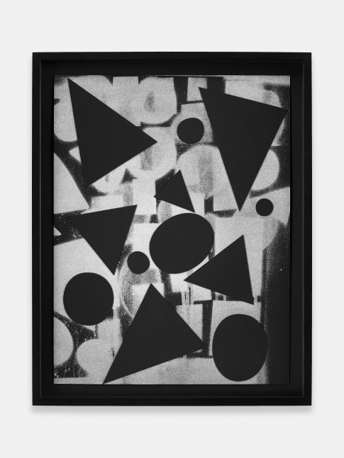 black and white collage of triangle and round shapes on paper