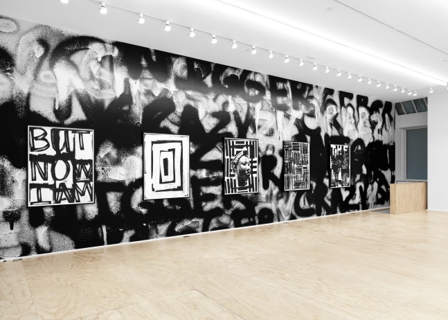 Installation view of Liam Gillick and Adam Pendleton films and wall-based works