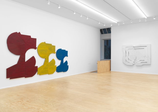Installation view of Wyatt Kahn wall reliefs and works on paper