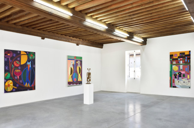 Installation view of paintings and sculptures by Austin Eddy