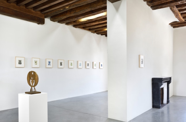 Installation view of paintings and sculptures by Austin Eddy