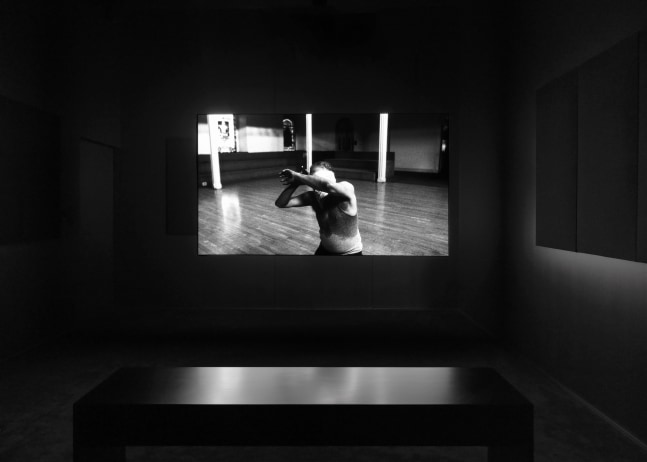 Installation view of Liam Gillick and Adam Pendleton films and wall-based works