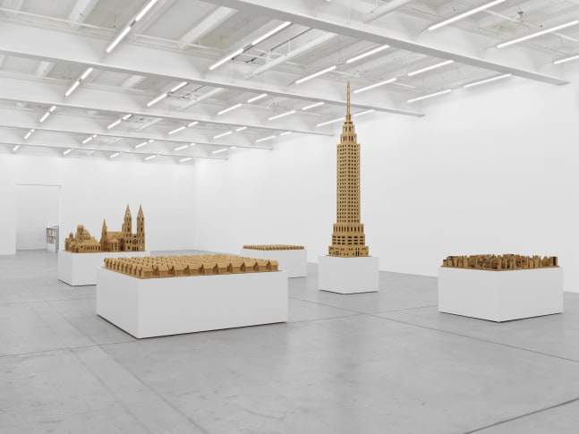 Installation view of cardboard cityscape sculptures by Jean-Frédéric Schnyder