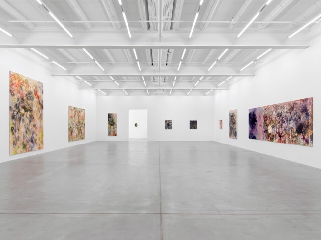 Installation view of Sam Falls paintings and ceramic reliefs exhibition
