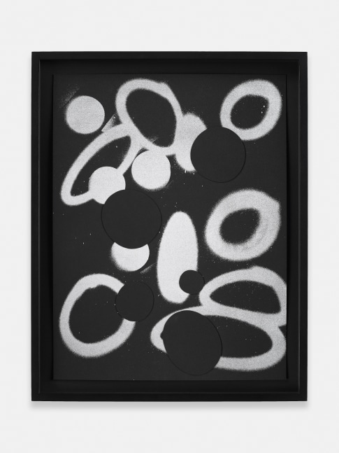 black and white collage of triangle and round shapes on paper