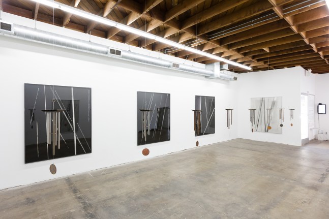 Installation view of paintings and sculptures by Sam Falls