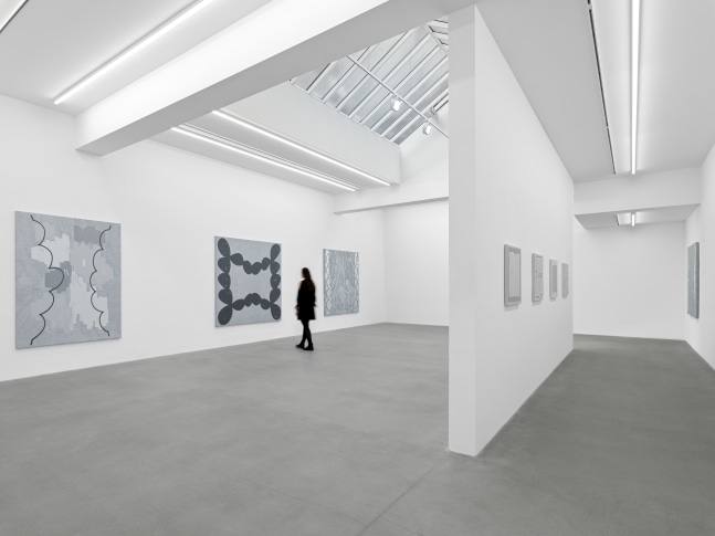 installation view of grayscale paintings by Amy Feldman