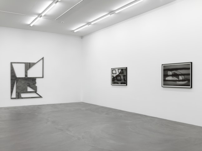 Installation view of Wyatt Kahn wall reliefs and photographs