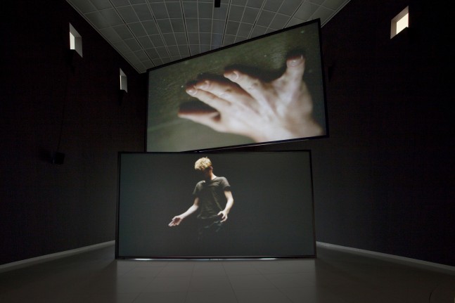 Installation view of video work by Douglas Gordon