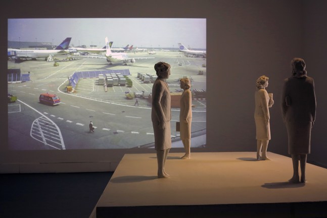 Installation view of video work and sculptures by Peter Fischli and David Weiss