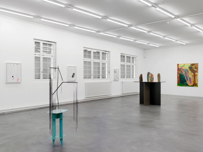 Installation view of group painting, photography, and sculpture exhibition