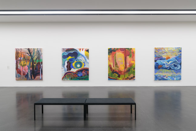 installation view of colorful paintings by Shara Hughes