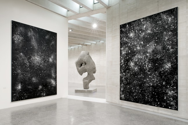 Installation view of sculpture and paintings by Ugo Rondinone