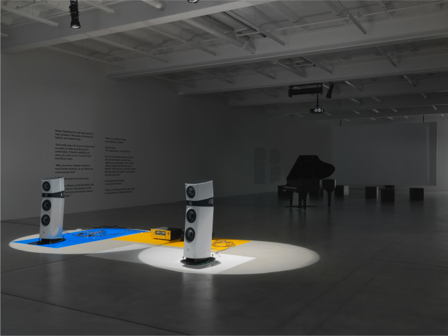 Installation view of Liam Gillick audio and film installation exhibition