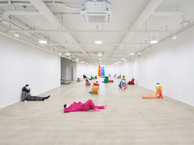 Installation view of clown sculptures by Ugo Rondinone