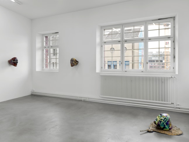 Installation view of group painting, photography, and sculpture exhibition