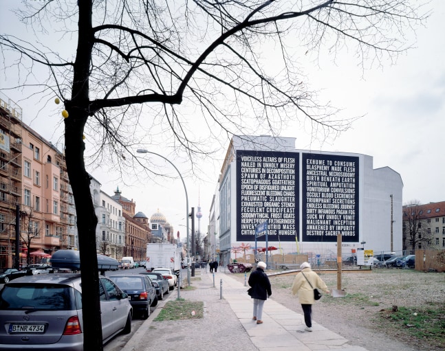Installation view of outside wall work by Steven Shearer