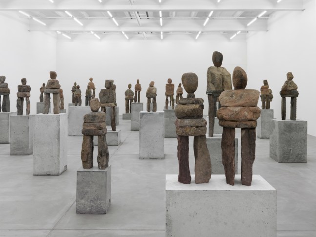 Installation view of Ugo Rondinone stone figure sculptures