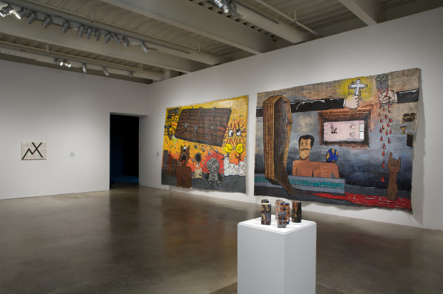Installation view of paintings by Tim Rollins and K.O.S.